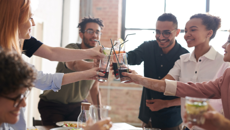 Friends drinking soda at an event