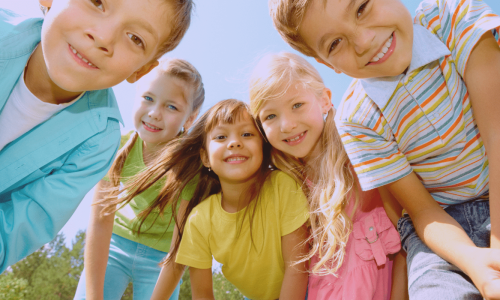 kids enjoying an event and looking into the camera