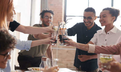 Friends drinking soda at an event